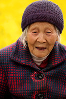 Chinese grandma in canola fields